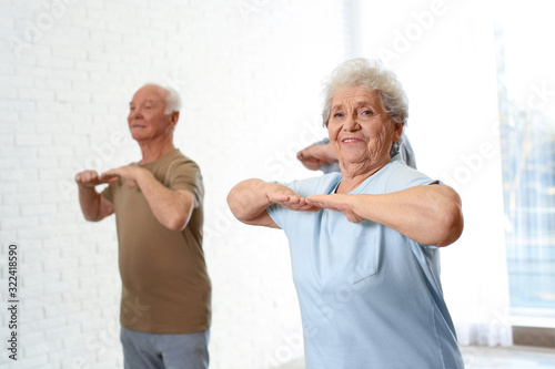 Elderly people training in hospital gym. Senior patients care