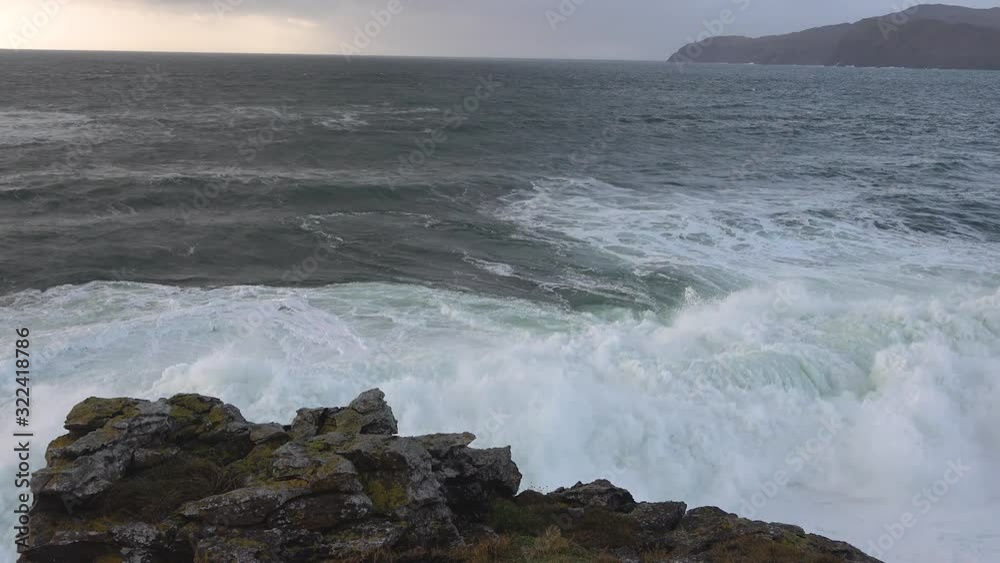 Huge waves breaking at Muckross Head - A small peninsula west of Killybegs, County Donegal, Ireland. The cliff rocks are famous for climbing Huge waves breaking at Muckross Head - A small peninsula west of Killybegs, County Donegal, Ireland. The cliff rocks are famous for climbing