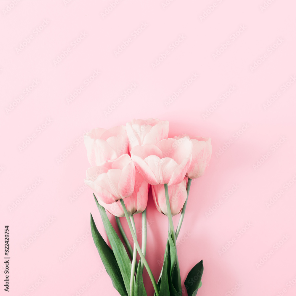 Fototapeta premium Beautiful composition spring flowers. Bouquet of pink tulips flowers on pastel pink background. Valentine's Day, Easter, Happy Women's Day, 8th march, Mother's Day. Flat lay, top view, copy space