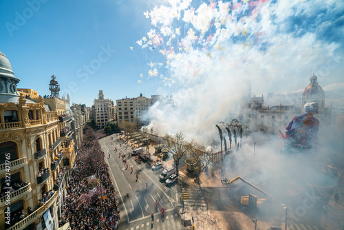 City hall square with fireworks exploding at Mascleta during the Las Fallas festival in Valencia Spain on March 19, 2019 Fallas Festival in its List of the Intangible Cultural Heritage of Humanity. photo