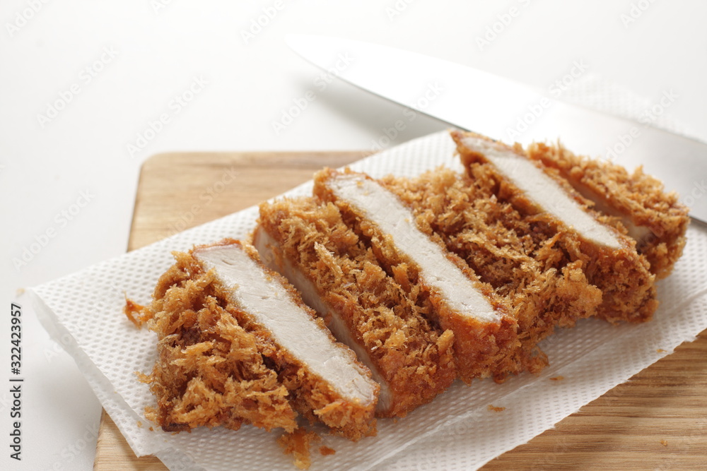 Japanese food, pork cutlet Tonkatsu on board Japanese food, pork cutlet Tonkatsu on board