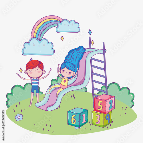 happy childrens day, girls playing in slide and boy with blocks park