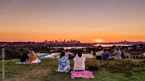 Sydney, NSW / Australia - April 28 2019: A group of community people enjoying the view of sydney on sunsetfrom Dover Height/Caffyn Park