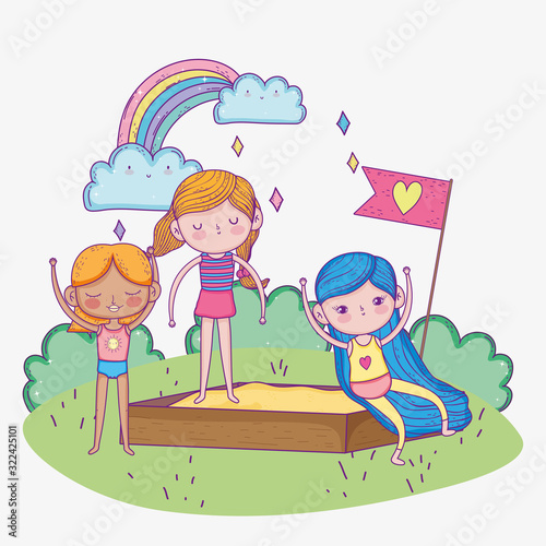 happy childrens day, girls playing in sandbox playground outdoors