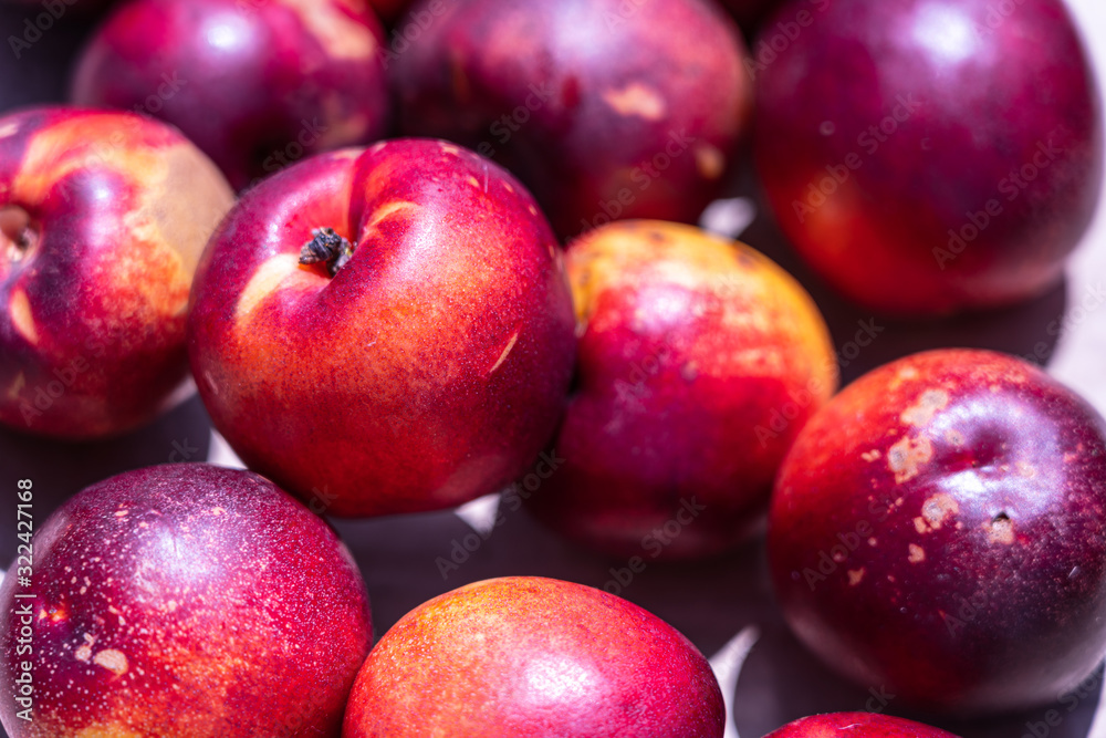 Fresh ripe nectarines at the market; background.