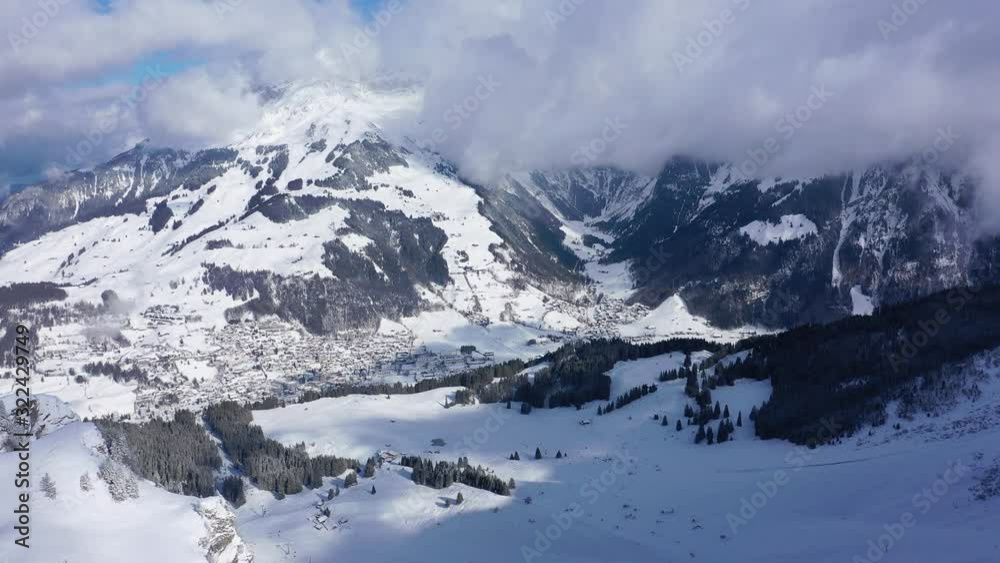 Beautiful sunny winter´s day in the alps with snow capped mountains - aerial drone footage - aerial photography Beautiful sunny winter´s day in the alps with snow capped mountains - aerial drone footage - aerial photography