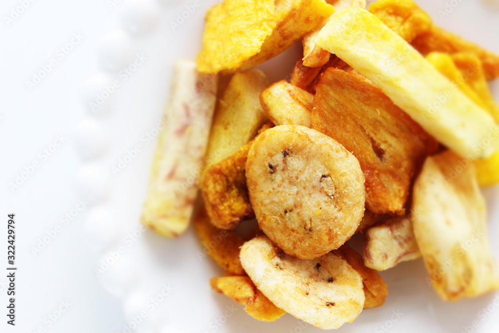 Dried and salted fruit and vegetable on dish Dried and salted fruit and vegetable on dish