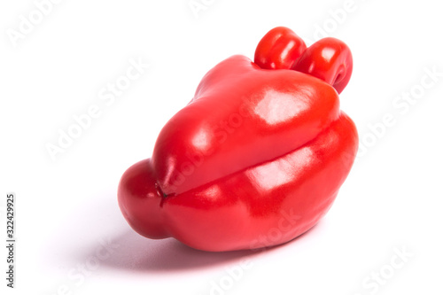 Ugly shaped organic vegetables. Deformed homegrown bell pepper isolated on white background © GladkovPhoto