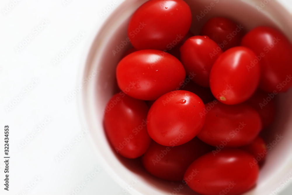 Freshness mini tomato on dish with copy space Freshness mini tomato on dish with copy space