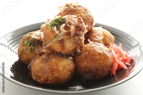 Japanese food, takoyaki octopus ball on dish and sauce