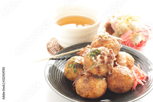 Japanese food, takoyaki octopus ball on dish and sauce
