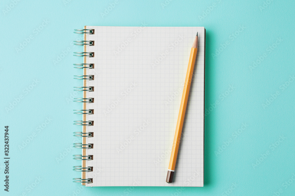 school notebook on cyan color background Top view school notebook on cyan color background Top view