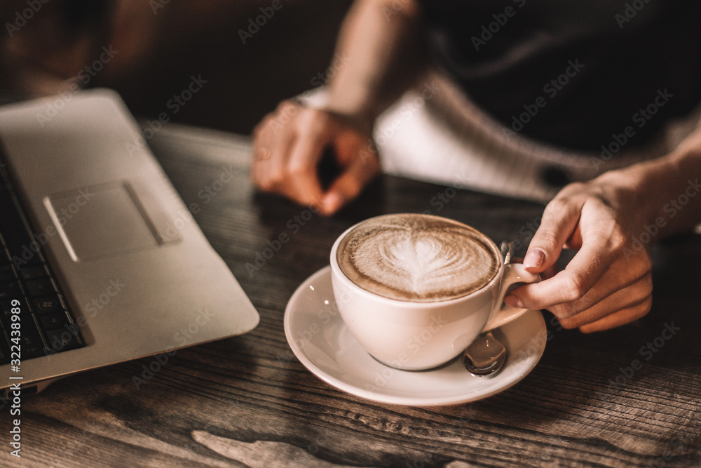 Beautiful woman drinking coffee sitting in a cafe. Beautiful woman drinking coffee sitting in a cafe.