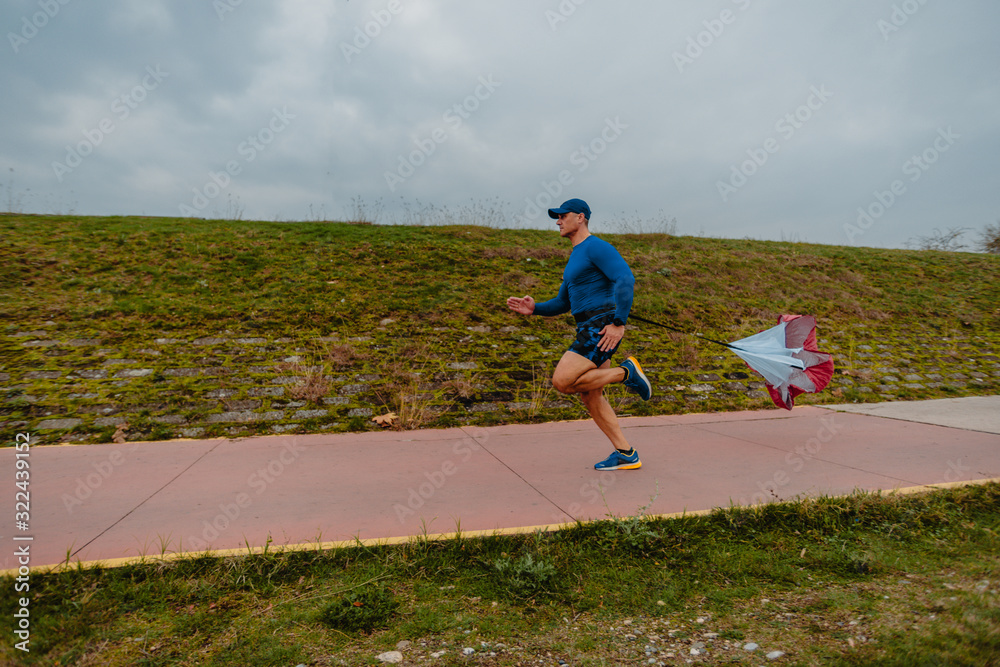 Fototapeta premium Running with speed resistance. Workout outdoors