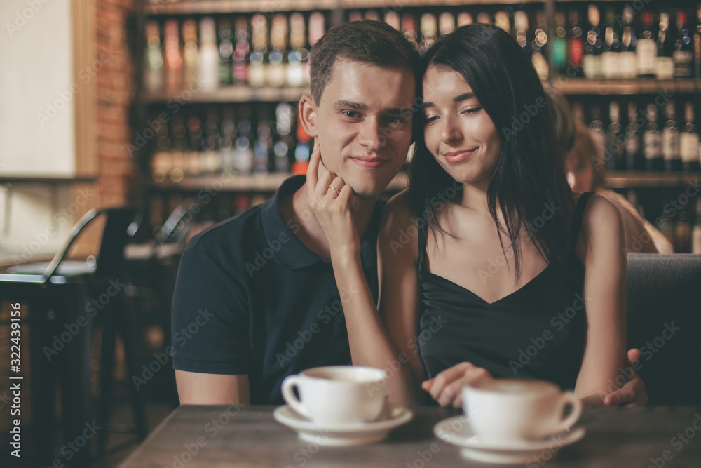 Loving couple hugging in the cafe. Loving couple hugging in the cafe.