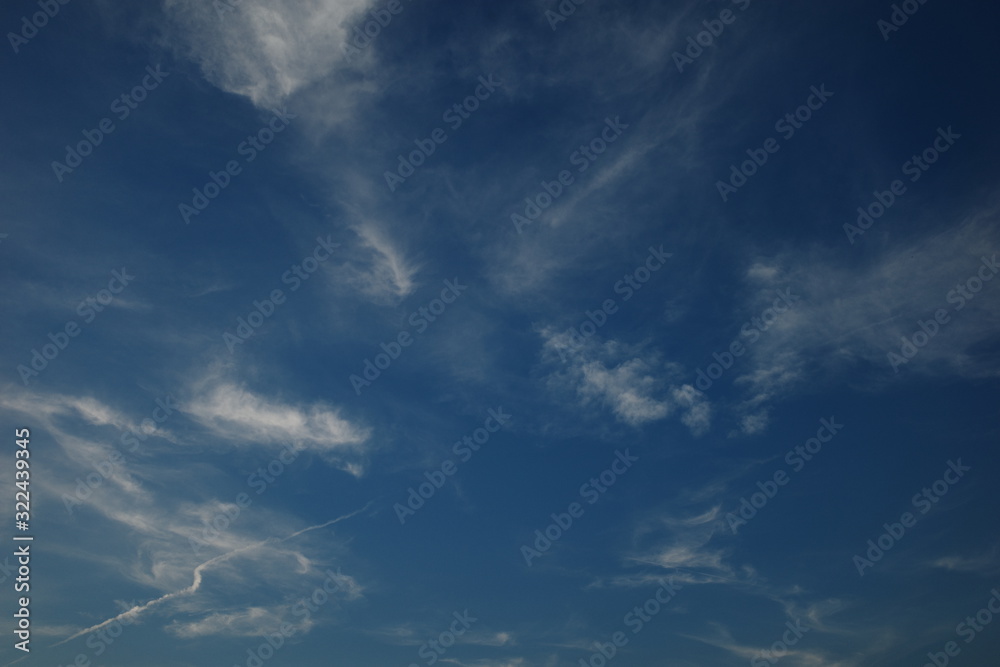 White fluffy clouds in the blue sky