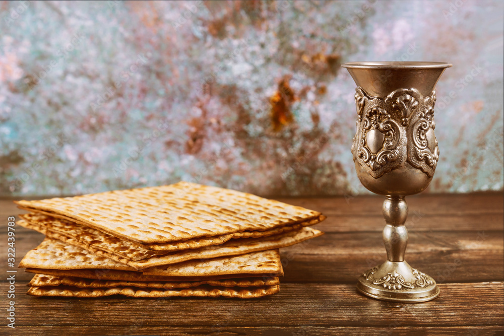 Matzos bread with kiddush cup of wine. Jewish pesah holiday. Stock Photo Adobe Stock
