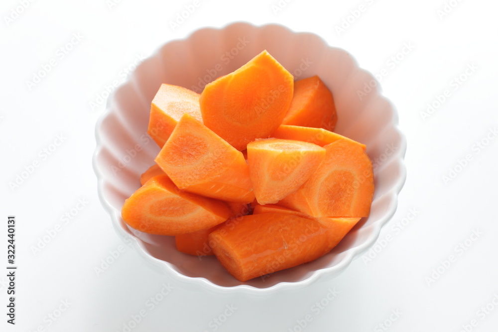 Chopped carrot in white bowl with copy space Chopped carrot in white bowl with copy space