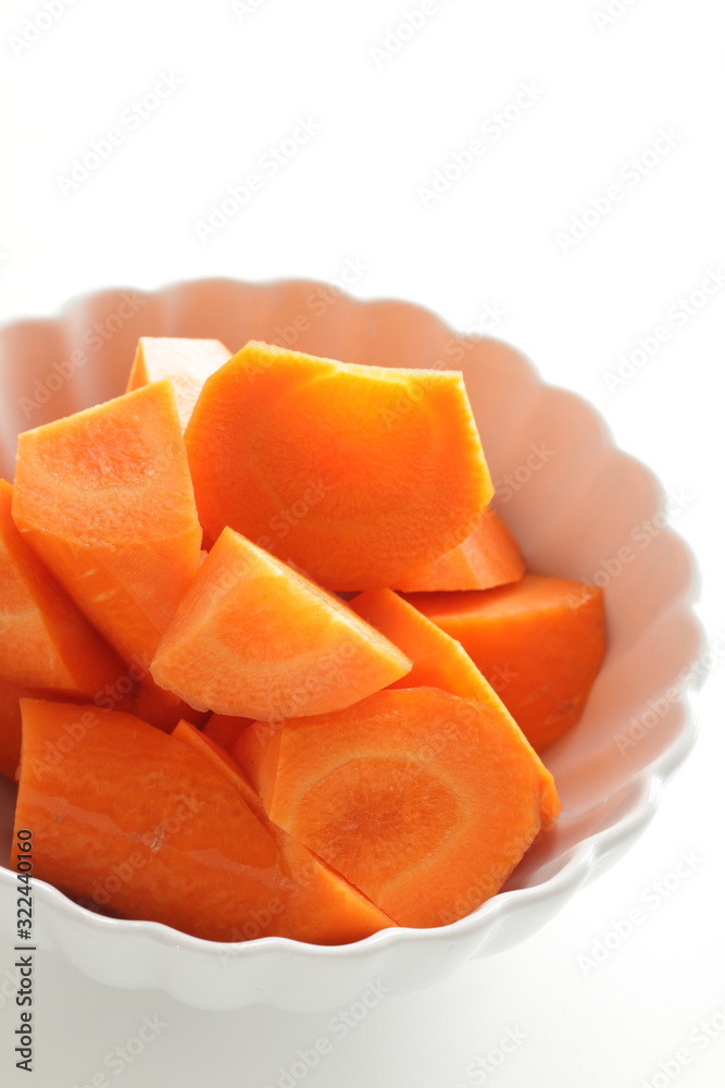 Chopped carrot in white bowl with copy space Chopped carrot in white bowl with copy space