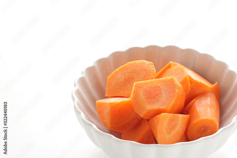 Chopped carrot in white bowl with copy space Chopped carrot in white bowl with copy space
