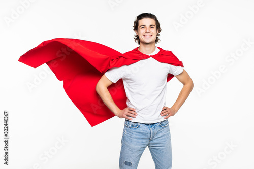 Young happy man in red superhero cape over white background photo