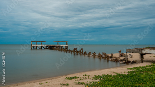 Dilapidated old fishing dock collapsing into the sea in Pak Nam Pran Thailand