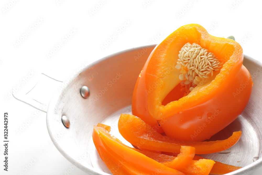 Orange color chopped orange paprika on pan for prepared food ingredient