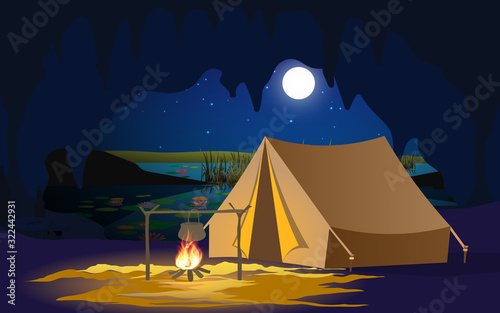 camping tent in the cave in the night