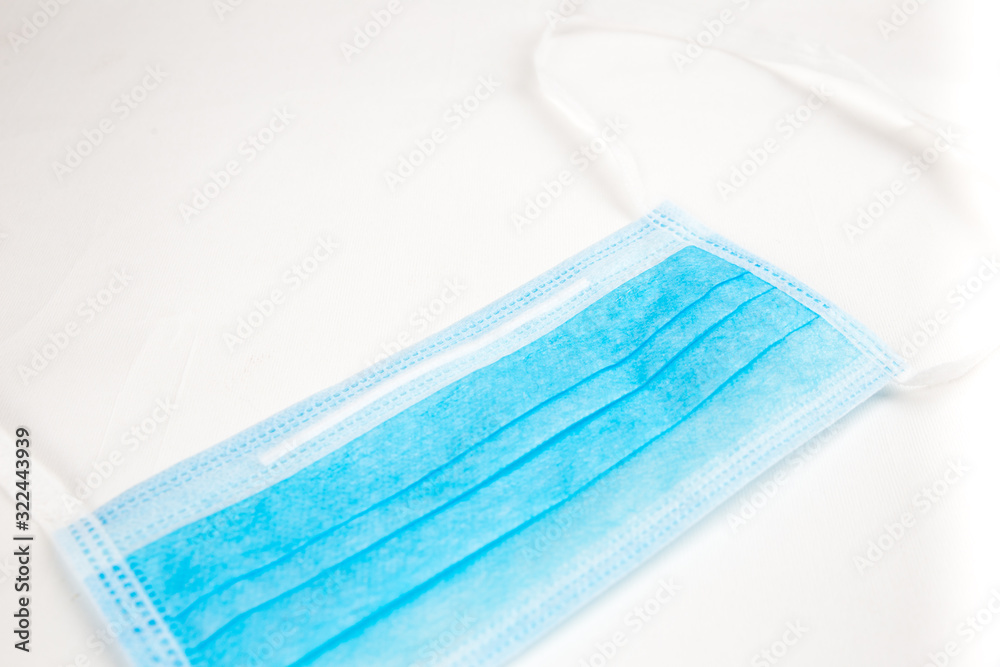 blue medical surgical disposable mask isolate on a white back ground blue medical surgical disposable mask isolate on a white back ground