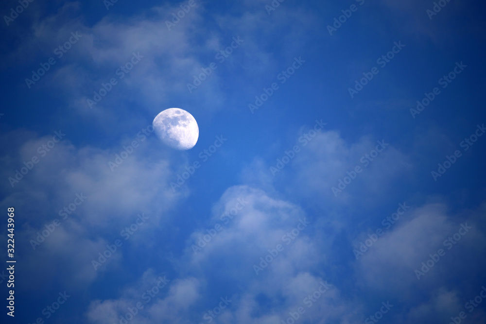 Beautiful cirrus clouds and Moon