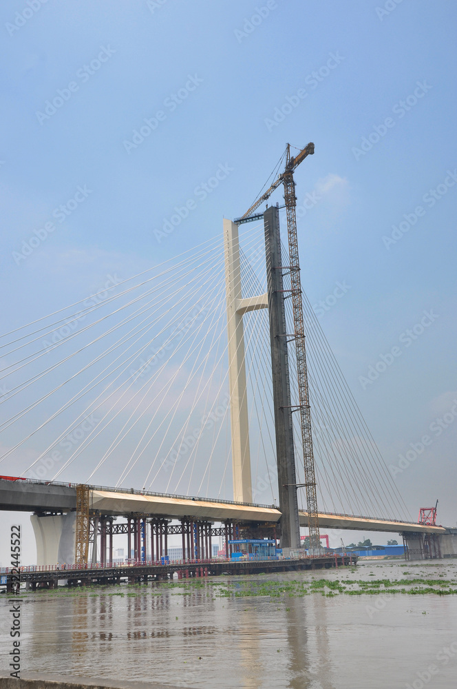 Tanjiang Bridge is an extra-large bridge that is a single pylon cable-stayed double-line railway bridge. The bridge is located in Xinhui, Jiangmen of Guangdong Province that is 5641.07 meters.