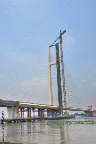 Tanjiang Bridge is an extra-large bridge that is a single pylon cable-stayed double-line railway bridge. The bridge is located in Xinhui, Jiangmen of Guangdong Province that is 5641.07 meters. © rourouguan