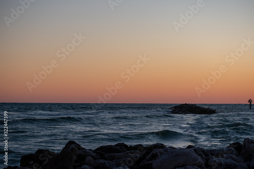 Fototapeta Naklejka Na Ścianę i Meble -  beach waves in ocean sunrise sunset