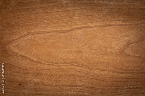 Walnut color wooden board texture background. Dark tone cherry wood plank background. Texture element.