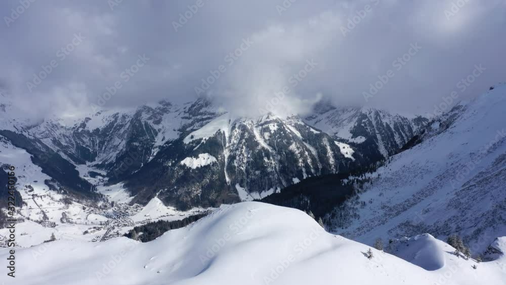 Flight over snow-capped mountains in the Swiss Alps on a winter's day - aerial photography Flight over snow-capped mountains in the Swiss Alps on a winter's day - aerial photography