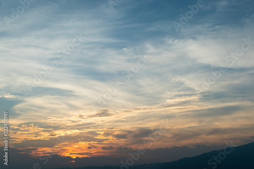 sunlight through cloud on dramatic sunset sky