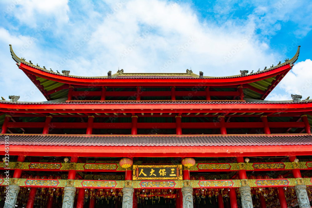 Semarang, Indonesia - CIRCA Nov 2019: The roof and facade of the main temple in Sam Po Kong (Gedung Batu) temple complex. It is dedicated to Zheng He, a Moslem chinese admiral. Semarang, Indonesia - CIRCA Nov 2019: The roof and facade of the main temple in Sam Po Kong (Gedung Batu) temple complex. It is dedicated to Zheng He, a Moslem chinese admiral.