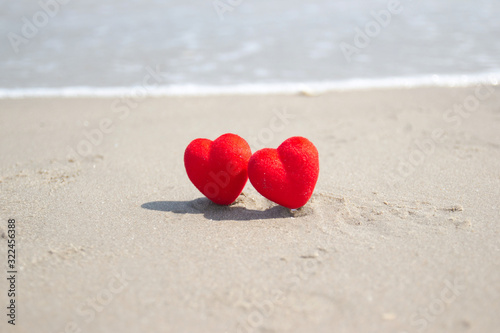 Red heart on a sandy beach. concept Valentine day
