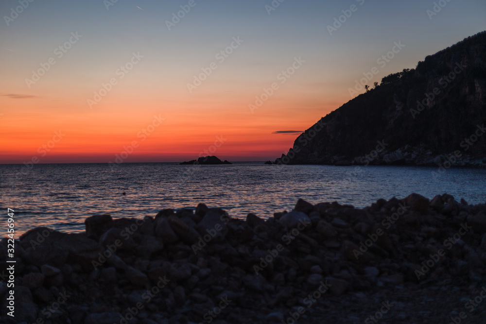 Sunset by the sea with mountain views. Montenegro 