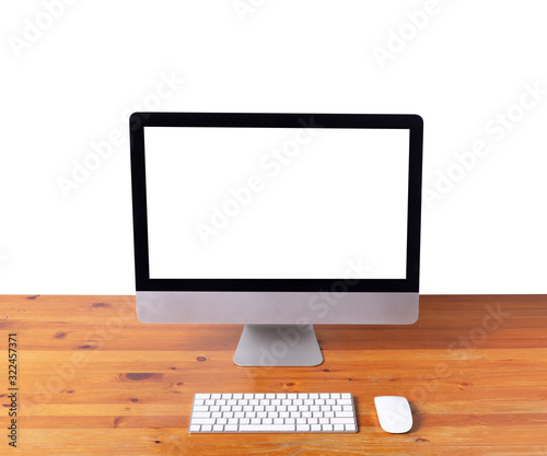 Computer white screen keyboard and mouse on table wood.