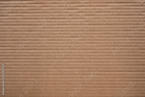 corrugated cardboard for packing. abstract background horizontal lines with wavy lines of beige color