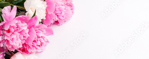Flowers composition. Frame made of pink white peony flowers on white background. Flat lay, top view, banner flyer, wedding, birthday, easter, mother woman day stylish