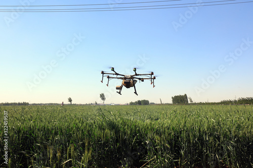 Agricultural UAVs pesticide wheat on a farm, China