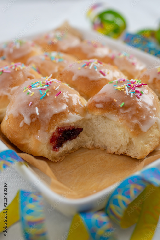 Traditional Polish donuts on wooden background. Tasty doughnuts with jam Traditional Polish donuts on wooden background. Tasty doughnuts with jam