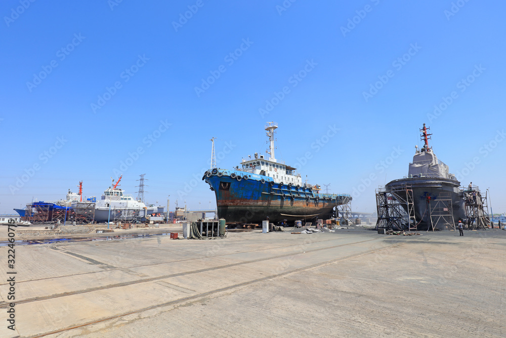 Fototapeta premium Ships awaiting repair are at the shipyard, Luannan County, Hebei Province, China