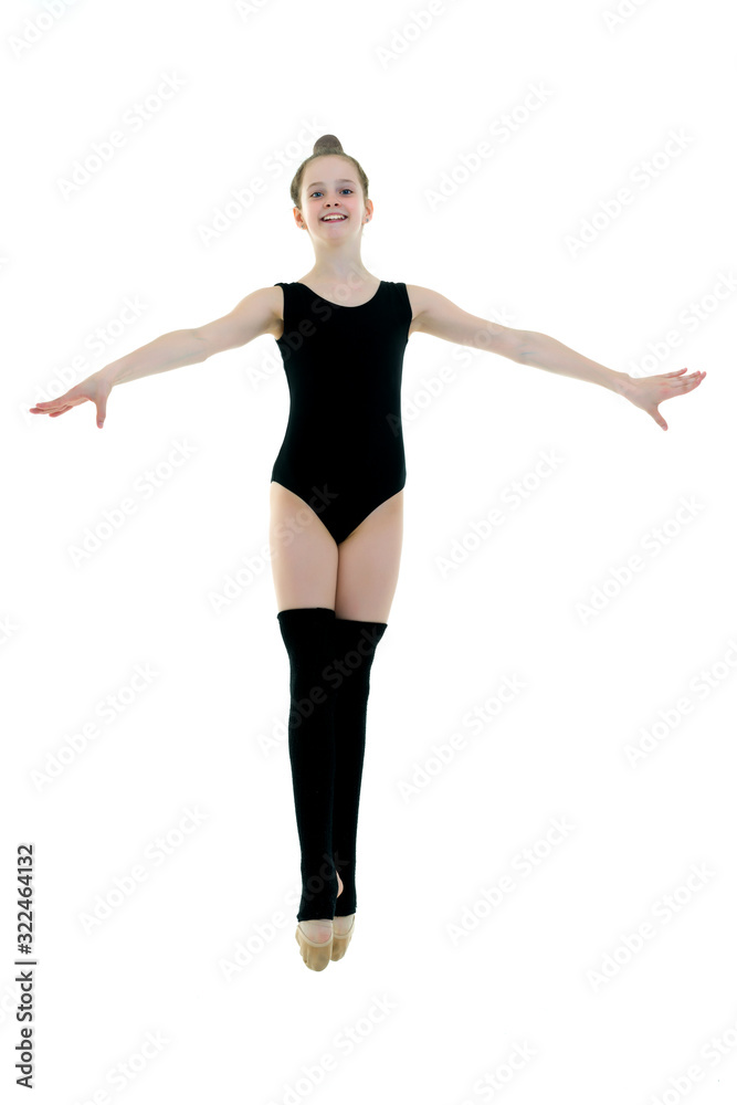 The concept of fitness, gymnastics, sports.The girl gymnast perf The concept of fitness, gymnastics, sports.The girl gymnast perf