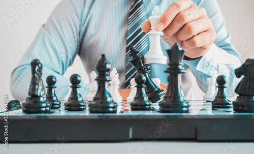 Businessmen are planning Growing your business through playing chess for the company to grow even more.