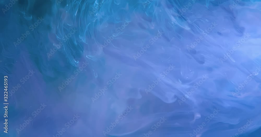 White Paint Threads and Drops Mixing in Water. Ink swirling. Underwater 4K Macro Shot. White Paint Threads and Drops Mixing in Water. Ink swirling. Underwater 4K Macro Shot.
