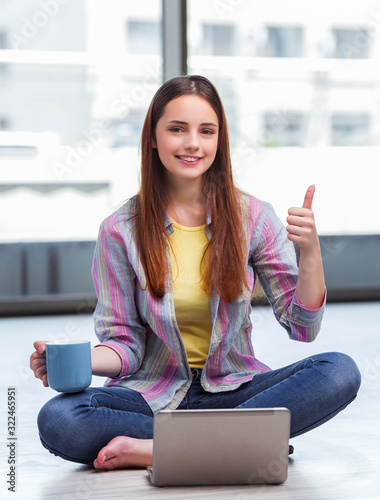 Young girl surfing internet on laptop Free Download Young girl surfing internet on laptop - GFXLoad