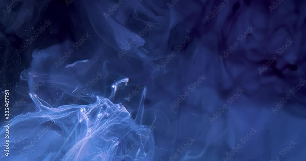 White Paint Threads and Drops Mixing in Water. Ink swirling. Underwater 4K Macro Shot. White Paint Threads and Drops Mixing in Water. Ink swirling. Underwater 4K Macro Shot.